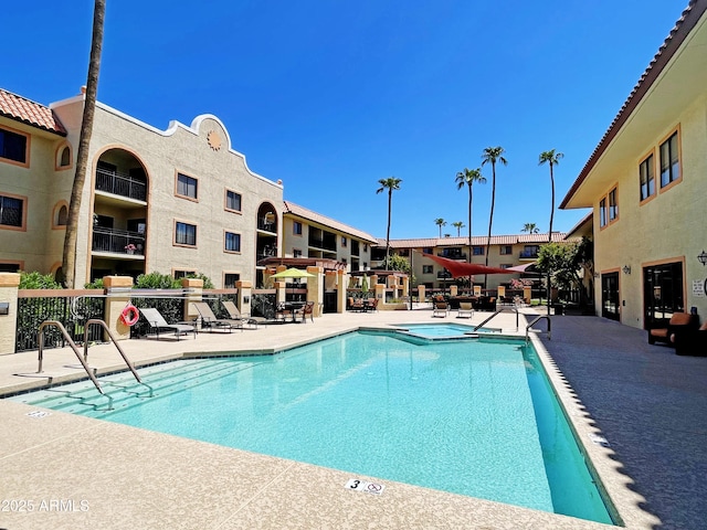 view of pool featuring a patio