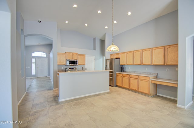 kitchen with stainless steel appliances, pendant lighting, light brown cabinets, high vaulted ceiling, and a kitchen island