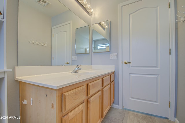 bathroom with vanity and tile patterned floors