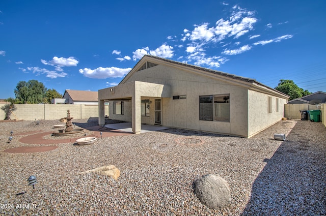 rear view of house with a patio