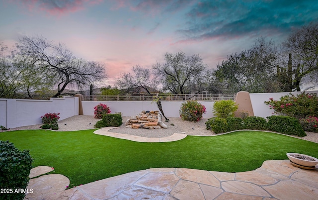 view of yard featuring a patio and a fenced backyard