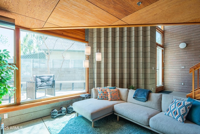 sunroom featuring wooden ceiling