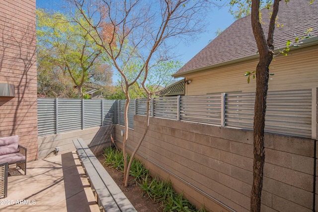 exterior space featuring a fenced backyard