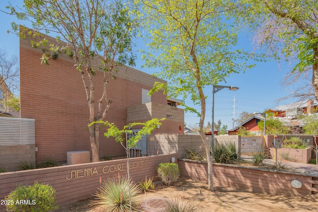 view of side of property with fence