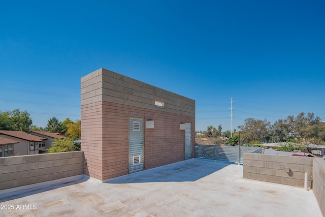 view of outbuilding with fence