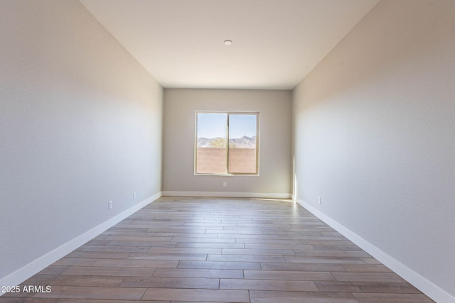 spare room featuring light wood-type flooring