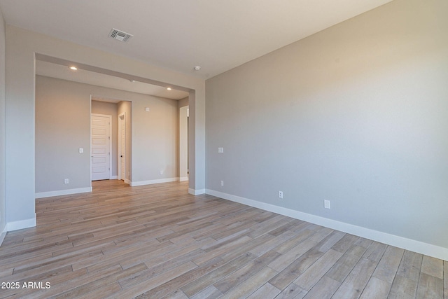 unfurnished room with light hardwood / wood-style flooring