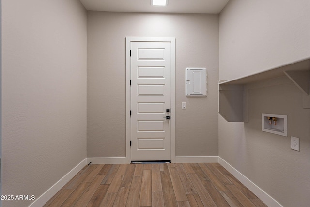 laundry area featuring hardwood / wood-style flooring and hookup for a washing machine