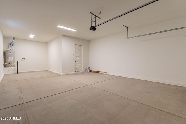 garage featuring gas water heater and a garage door opener