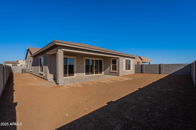 back of property featuring a patio