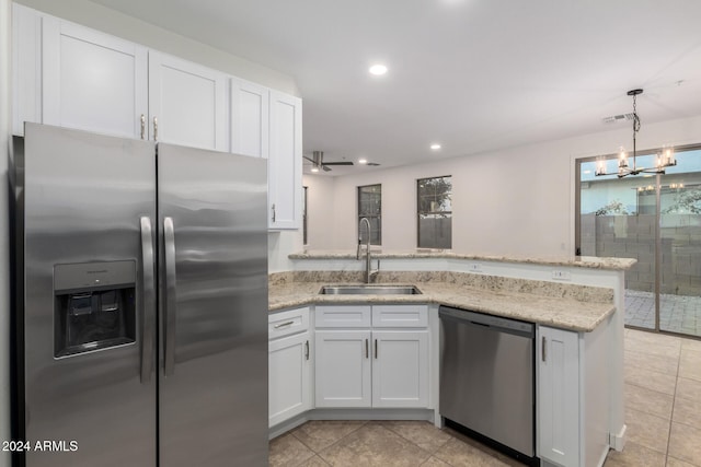 kitchen featuring ceiling fan with notable chandelier, white cabinetry, sink, and appliances with stainless steel finishes