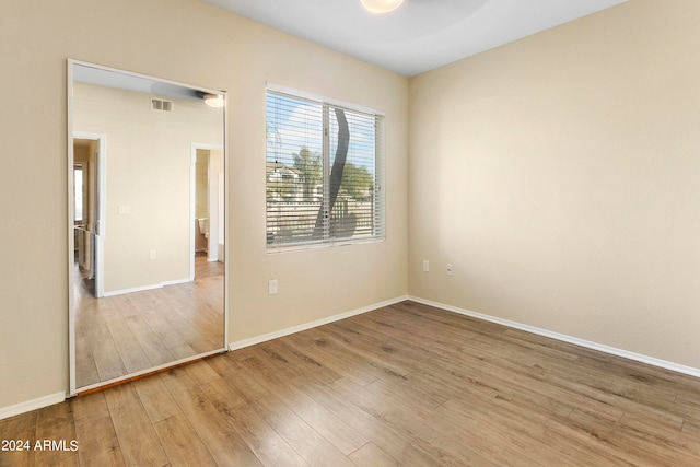 spare room featuring light hardwood / wood-style floors