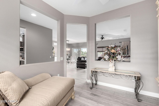 interior space featuring ceiling fan and light hardwood / wood-style flooring