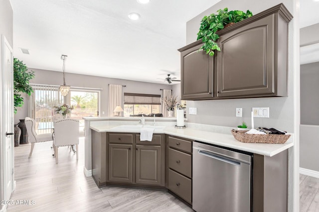 kitchen with dishwasher, sink, ceiling fan, kitchen peninsula, and light hardwood / wood-style flooring