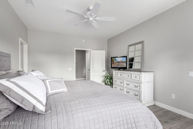 bedroom with ceiling fan and hardwood / wood-style floors