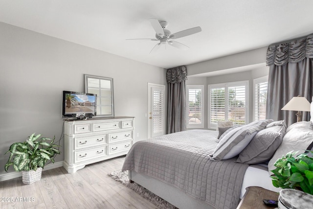 bedroom with light hardwood / wood-style flooring and ceiling fan