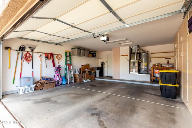 garage with water heater and a garage door opener