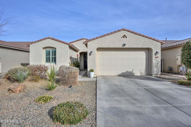 mediterranean / spanish-style home featuring a garage