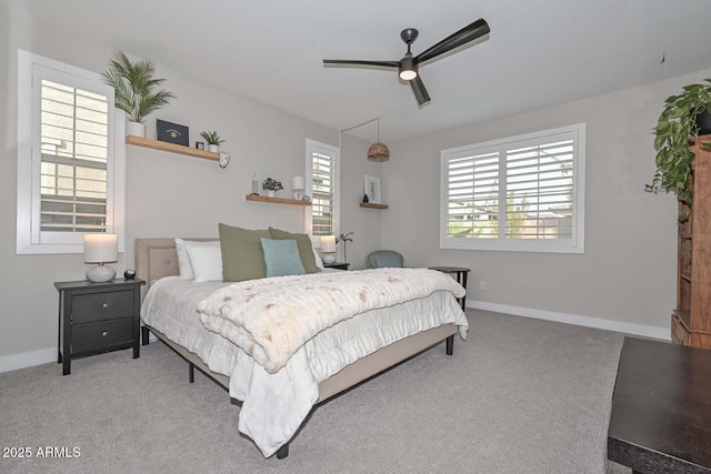 bedroom with ceiling fan and carpet floors