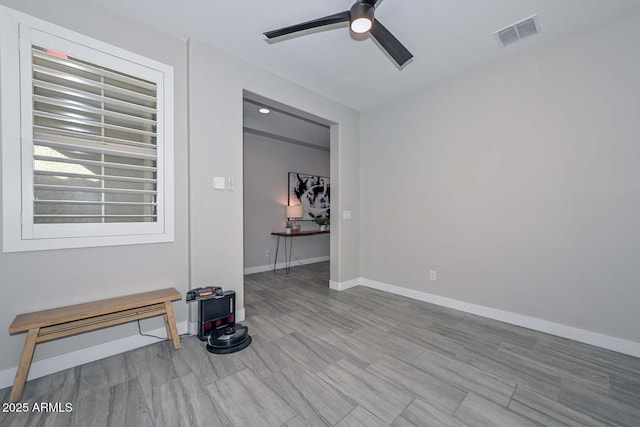 unfurnished room with ceiling fan