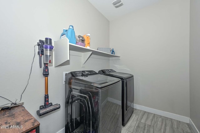 washroom featuring washing machine and clothes dryer