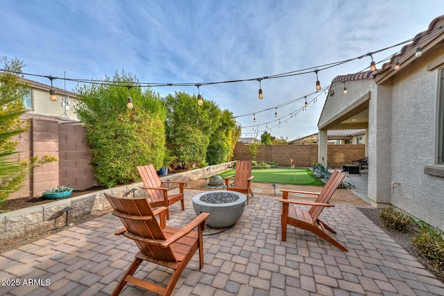 view of patio / terrace with an outdoor fire pit