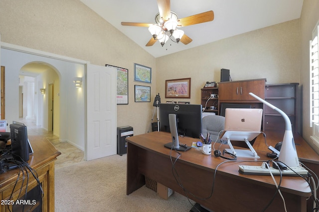 office space with ceiling fan, light colored carpet, and lofted ceiling