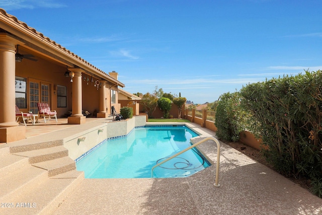 view of pool with ceiling fan and a patio