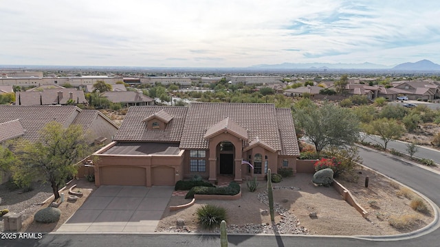 view of front of home featuring a mountain view and a garage