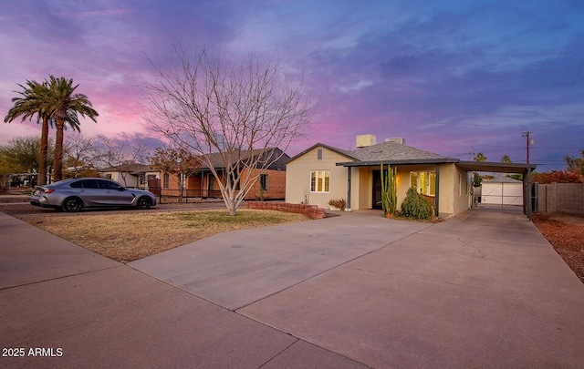 view of front of property featuring a carport