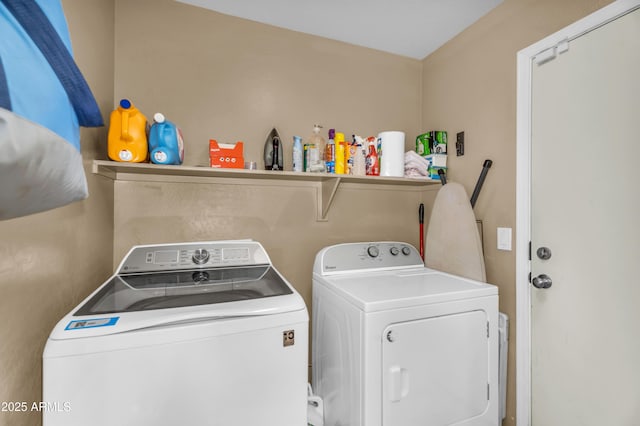 laundry room featuring independent washer and dryer and laundry area