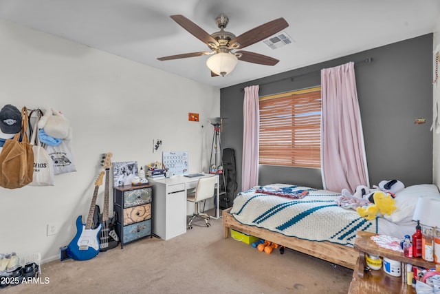 bedroom featuring visible vents, carpet, and a ceiling fan