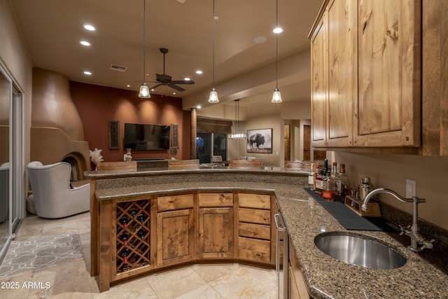 25031 N Paso Trl, Scottsdale, AZ 85255 - kitchen featuring recessed lighting, dark stone counters, a sink, pendant lighting, and a peninsula