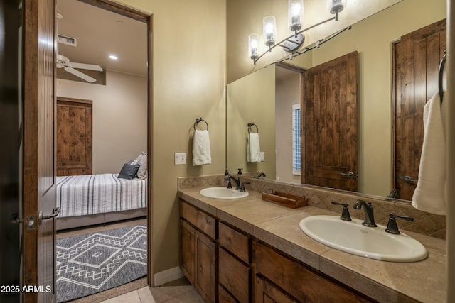 25031 N Paso Trl, Scottsdale, AZ 85255 - ensuite bathroom featuring double vanity, ceiling fan, a sink, and tile patterned flooring