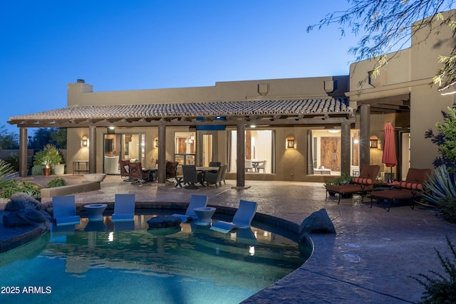 25031 N Paso Trl, Scottsdale, AZ 85255 - rear view of property featuring a chimney, stucco siding, an outdoor pool, and a patio area