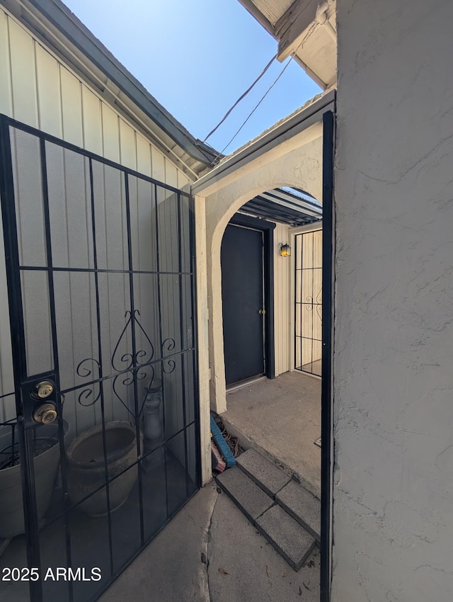 3827 N 8th St, Phoenix, AZ 85014 - entrance to property with a gate and board and batten siding