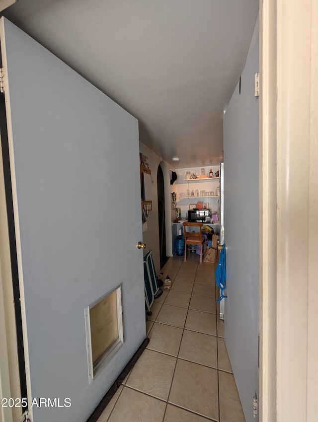 3827 N 8th St, Phoenix, AZ 85014 - hallway featuring light tile patterned flooring and arched walkways