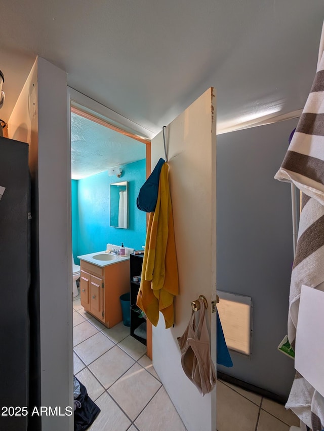 3827 N 8th St, Phoenix, AZ 85014 - bathroom with tile patterned floors, vanity, and toilet