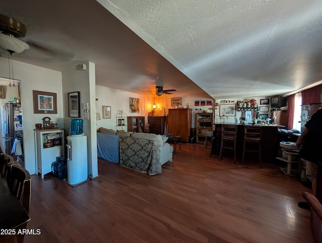 3827 N 8th St, Phoenix, AZ 85014 - living room with ceiling fan, wood finished floors, and a textured ceiling