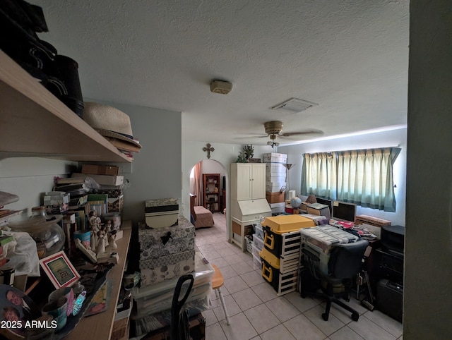 3827 N 8th St, Phoenix, AZ 85014 - office space featuring arched walkways, light tile patterned flooring, a textured ceiling, and ceiling fan