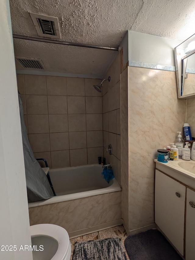 3827 N 8th St, Phoenix, AZ 85014 - bathroom with shower / bath combination with curtain, toilet, vanity, and a textured ceiling