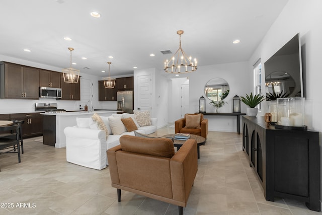 655 S Jacana Ln, Gilbert, AZ 85296 - living room with a chandelier, recessed lighting, and light tile patterned floors