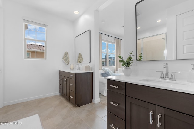 655 S Jacana Ln, Gilbert, AZ 85296 - bathroom featuring healthy amount of natural light, vanity, baseboards, and a shower stall