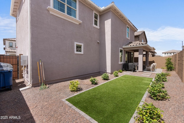 655 S Jacana Ln, Gilbert, AZ 85296 - rear view of property featuring stucco siding and a patio area