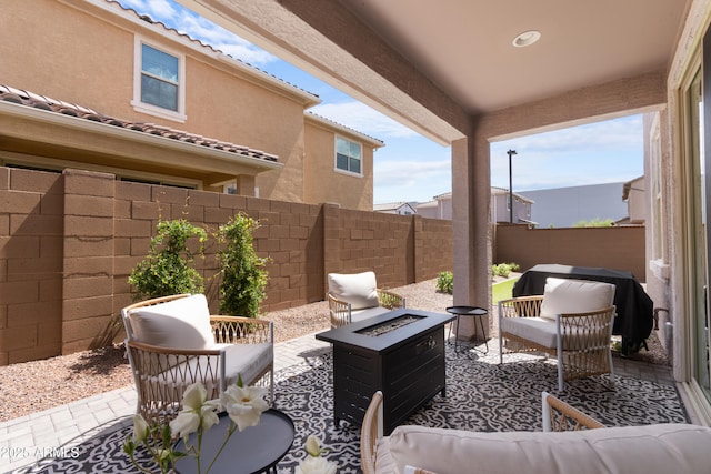 655 S Jacana Ln, Gilbert, AZ 85296 - fenced backyard featuring a patio and an outdoor living space with a fire pit