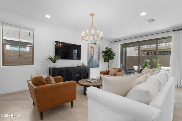 655 S Jacana Ln, Gilbert, AZ 85296 - living room featuring a chandelier, plenty of natural light, recessed lighting, and light tile patterned floors