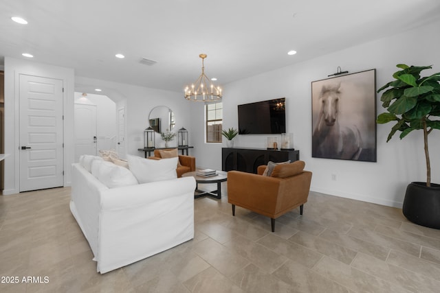 655 S Jacana Ln, Gilbert, AZ 85296 - living room with recessed lighting, arched walkways, a chandelier, light tile patterned flooring, and baseboards