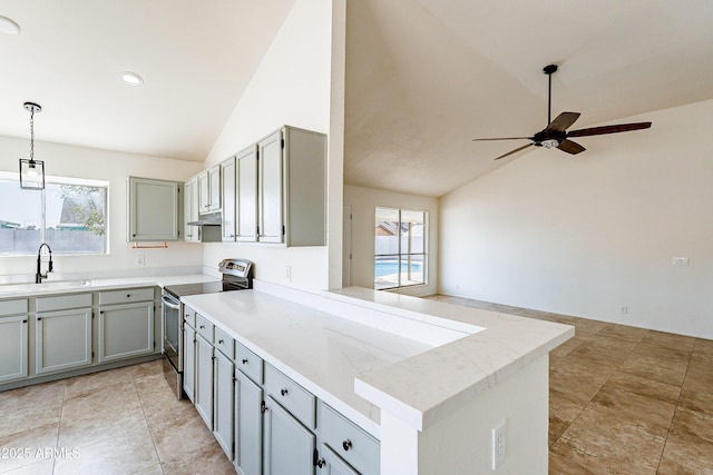 kitchen with vaulted ceiling, kitchen peninsula, sink, and stainless steel electric range