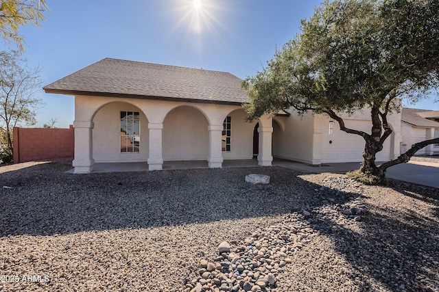 mediterranean / spanish house with a garage