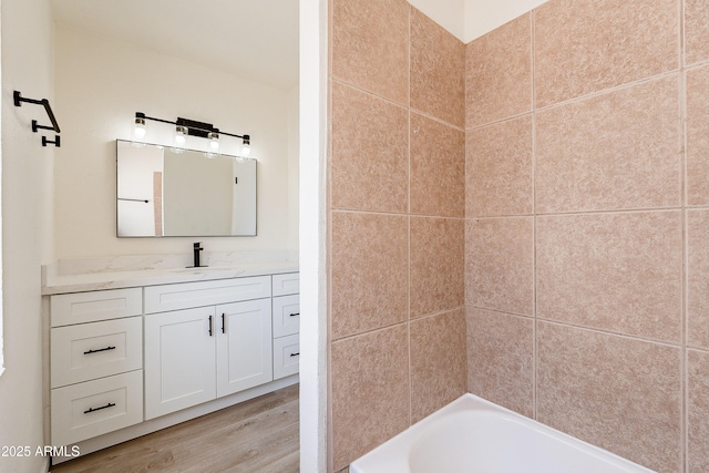 bathroom with hardwood / wood-style floors and vanity